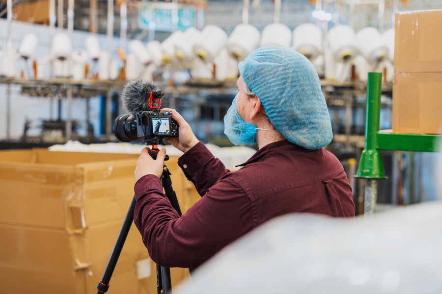 Liam filming inside a manufacturing facility